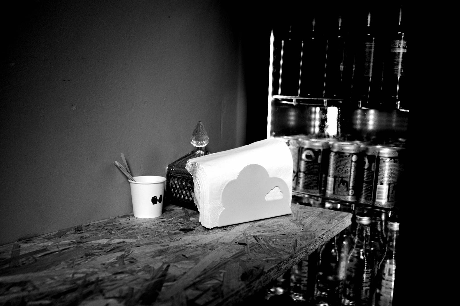 Napkins, branded cup and condiments on the DOUGH counter