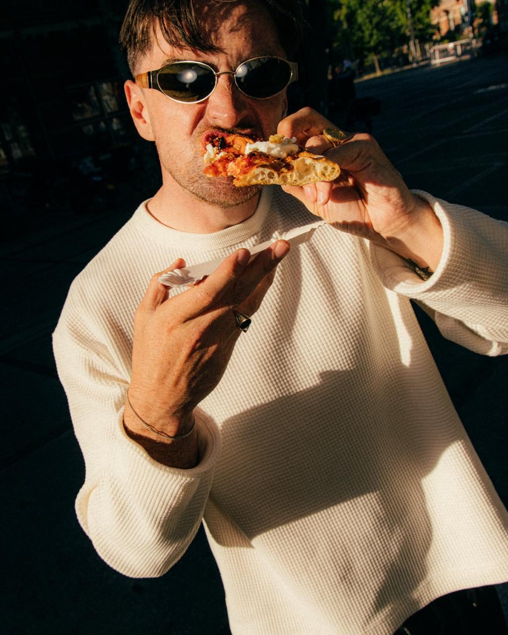 Eating a NO FLOP slice in the evening sun in Westerpark